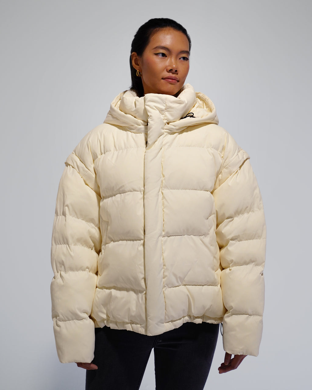White Wavy streetwear puffer jacket outfit
Model wearing White Wavy convertible puffer jacket