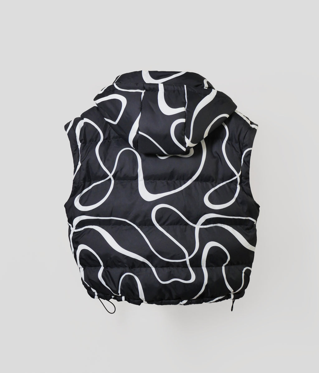 Black puffer vest with white abstract patterns on a light gray background