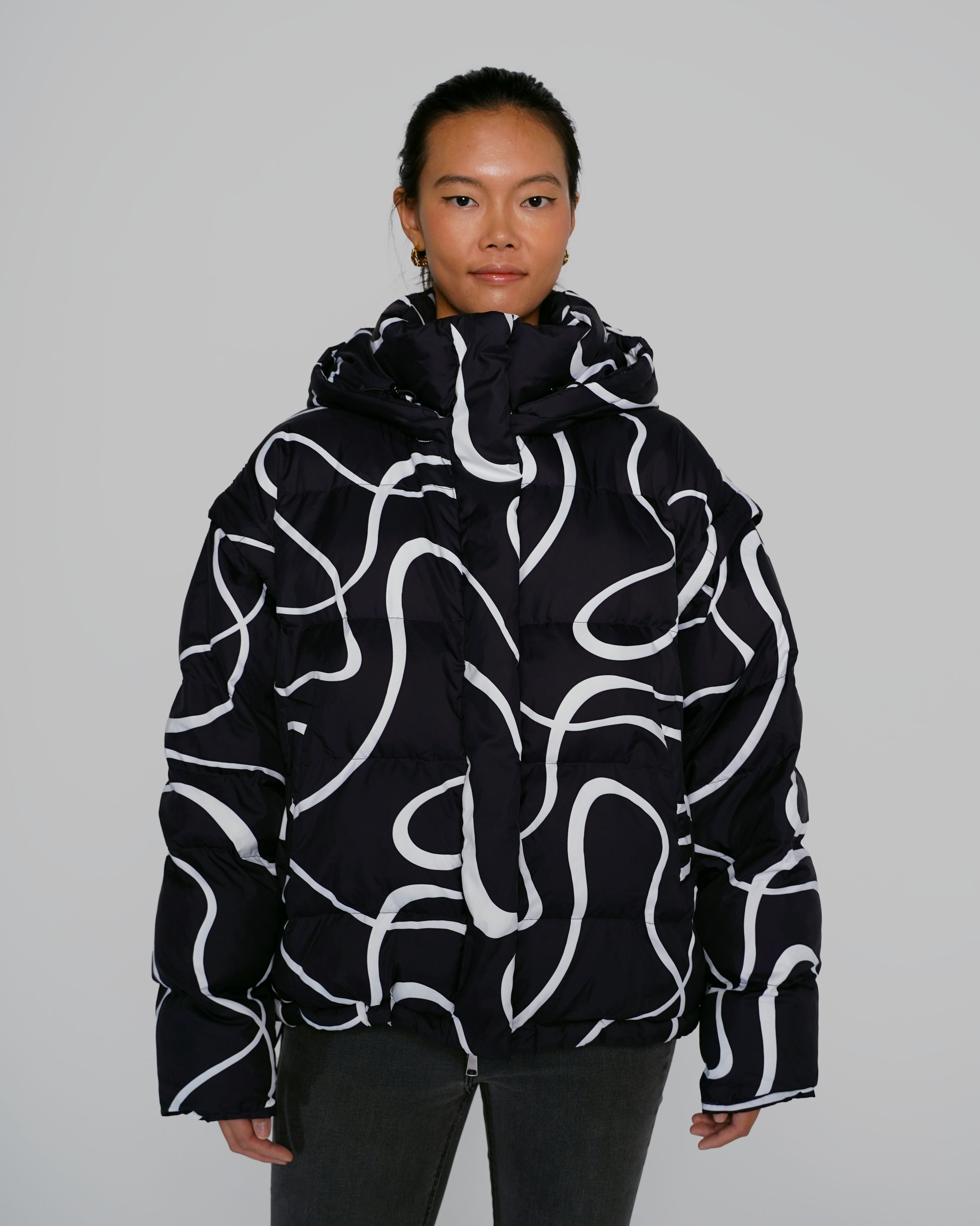 Black Wavy streetwear puffer jacket outfit Model wearing Black Wavy convertible puffer jacket