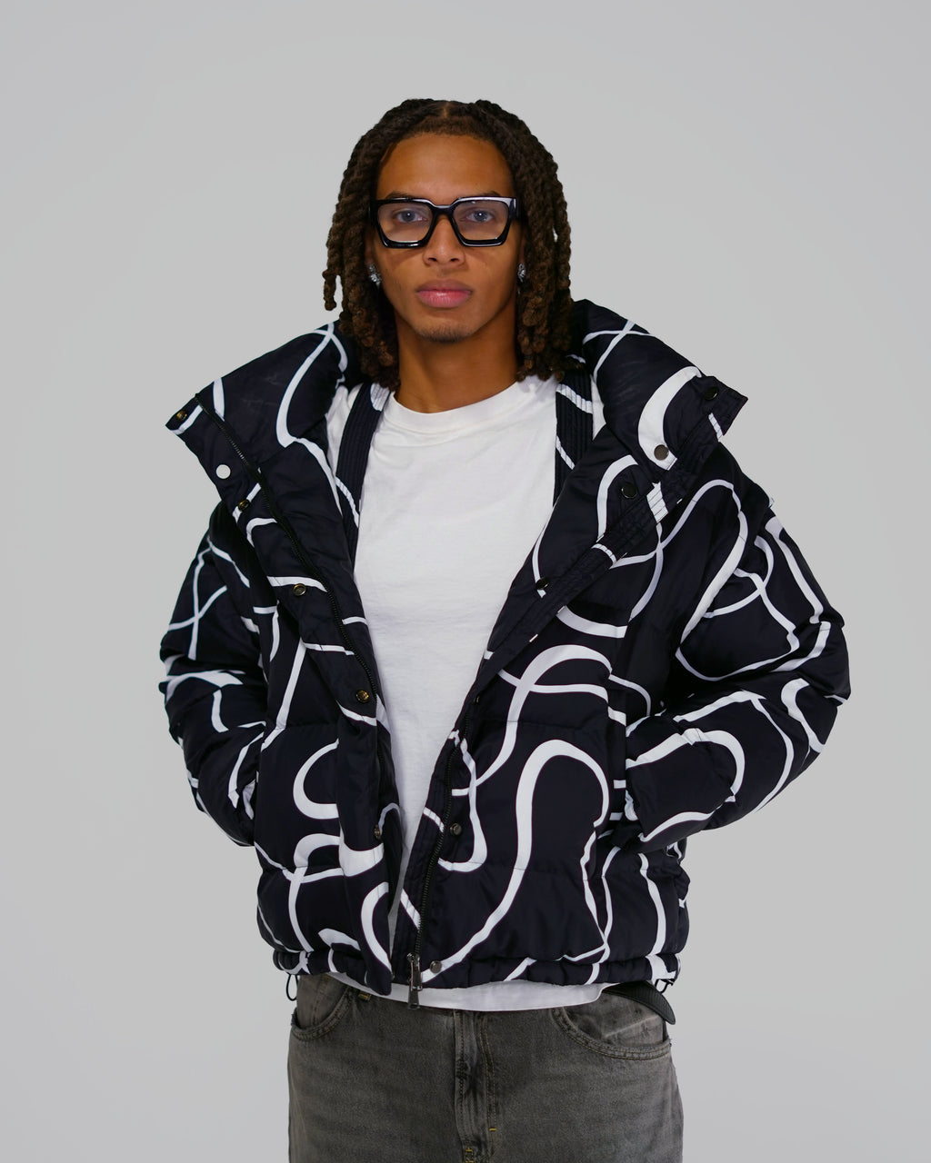 Black Wavy streetwear puffer jacket outfit Model wearing Black Wavy convertible puffer jacket