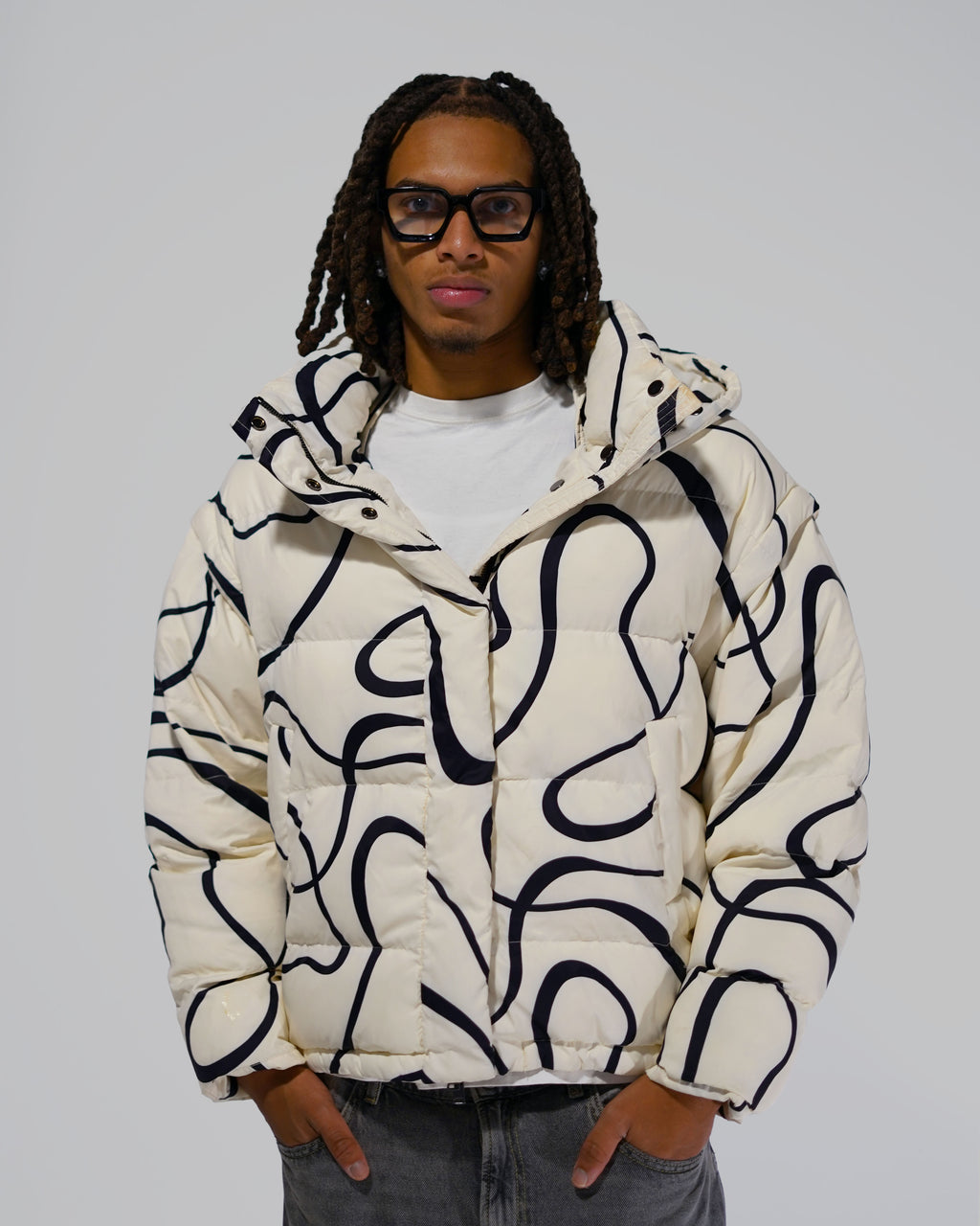 White Wavy streetwear puffer jacket outfit
Model wearing White Wavy convertible puffer jacket