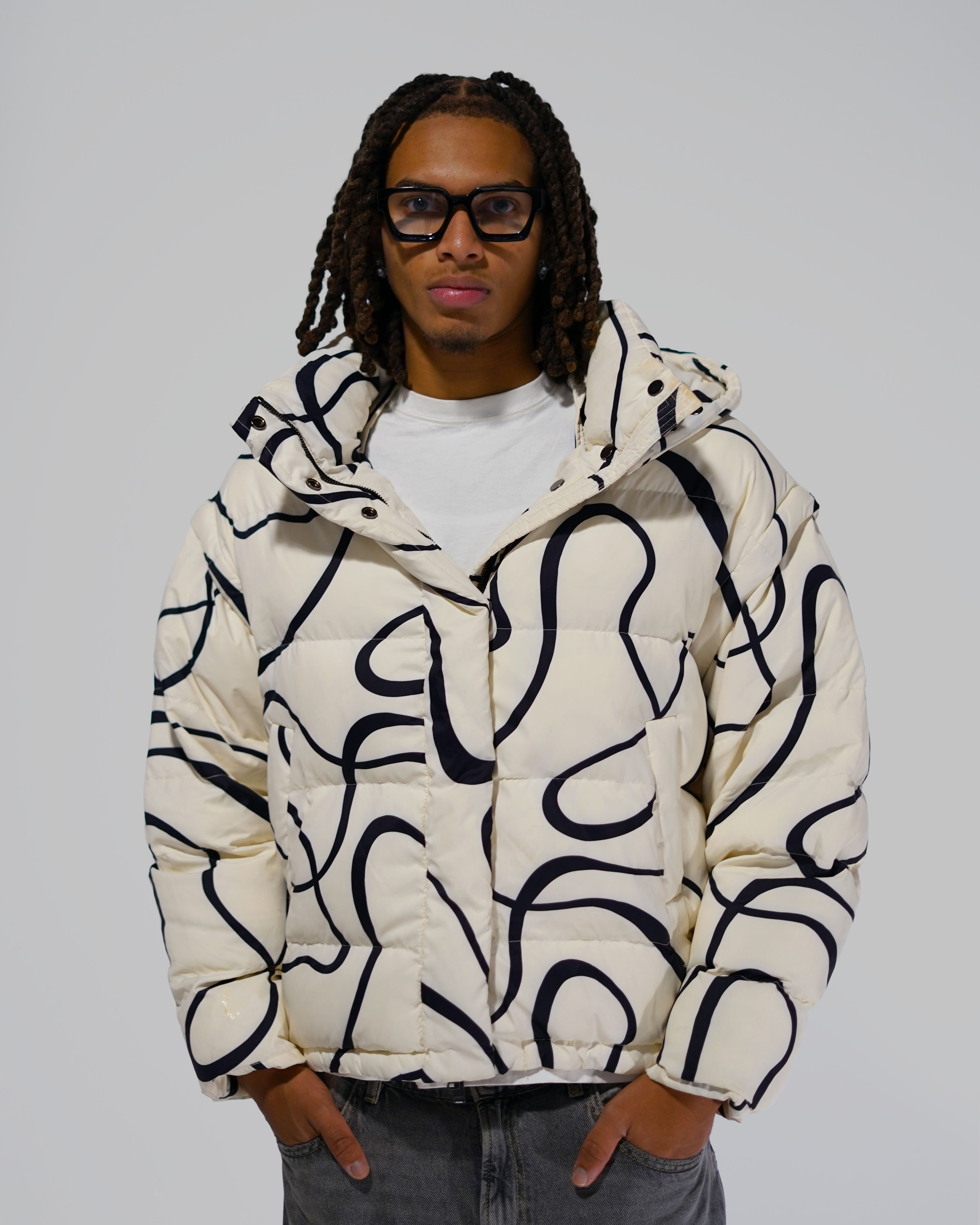 White Wavy streetwear puffer jacket outfit
Model wearing White Wavy convertible puffer jacket