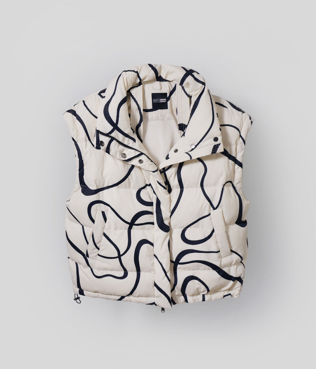 White Wavy puffer vest with detachable sleeves removed
White Wavy 2-in-1 jacket worn as vest